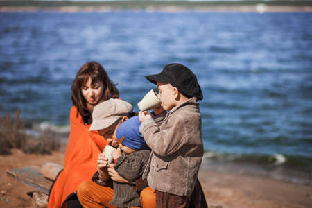 A large family resting on the river.の写真素材