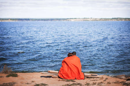 The Young couple resting on the river.の写真素材