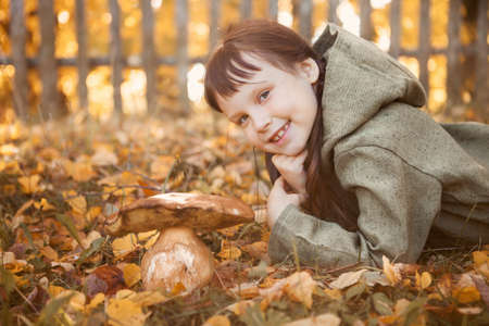 The little girl went to pick mushrooms.の写真素材