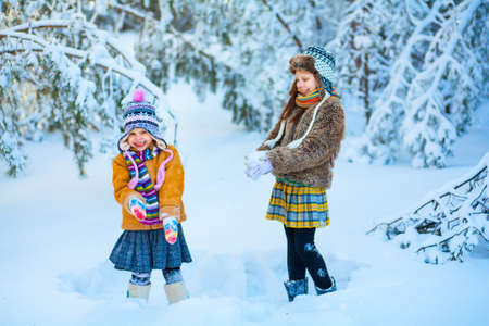Children in the winter woods happy outdoors.の写真素材