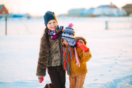 The Children playing outside in the winter.の写真素材