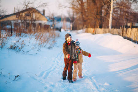 The Children playing outside in the winter.の写真素材
