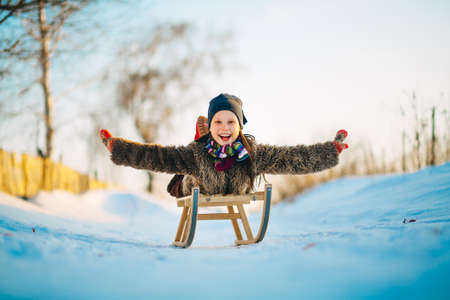 The Children playing outside in the winter.の写真素材