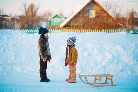 The Children playing outside in the winter.の写真素材