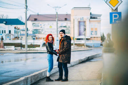 A loving young couple walks around the city.の写真素材