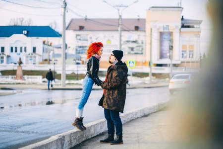 A loving young couple walks around the city.の写真素材