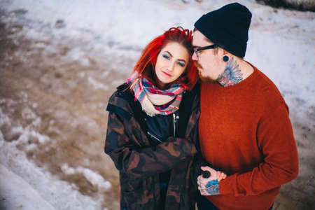 A loving young couple walks around the city.の写真素材