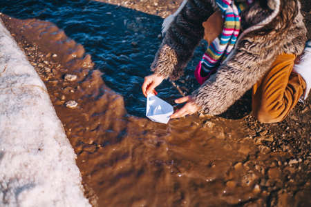 Little girls playing on the street in the village.の写真素材
