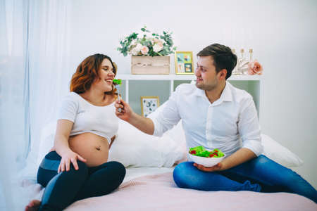 The Young pregnant woman in home interior.