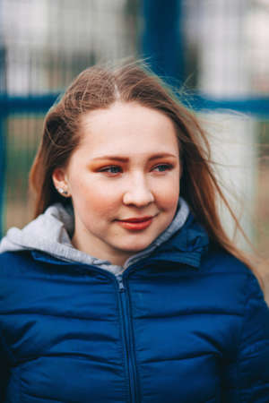 The Portrait of a young woman outdoors.の写真素材