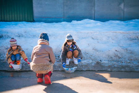 Little girls playing on the street in the village.の写真素材