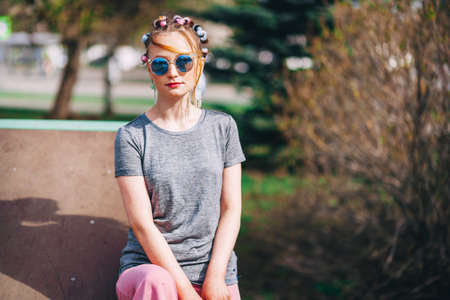 The Young woman portrait with a skateboard.の写真素材