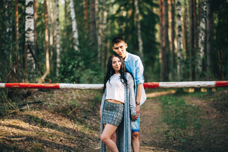 A young couple is resting on nature.の写真素材