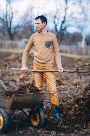 The man is working in the garden.