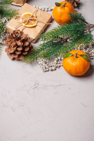 Christmas presents and oranges on grey stone backgroundの写真素材