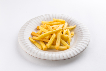 French fries on white plate isolated on white background side viewの写真素材