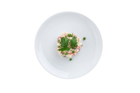 Russian traditional salad Olivier with parsley isolated on white background top viewの写真素材