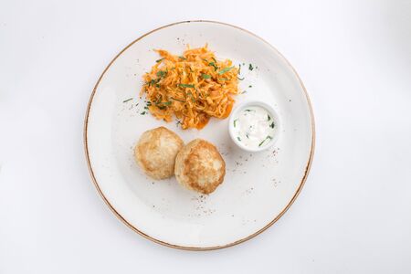 meat balls and cabbage stew with white sauce isolated on white background top viewの写真素材