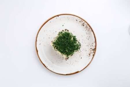potato salad with dill on top isolated on white background top viewの写真素材