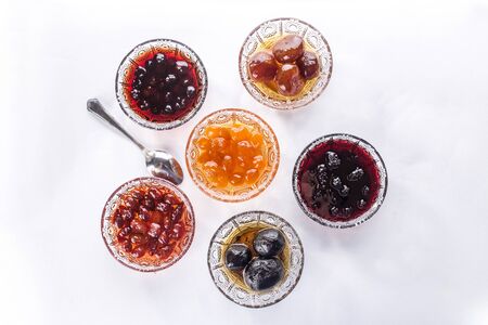 Set of jam collection with different berries and fruits isolated on white background top viewの写真素材