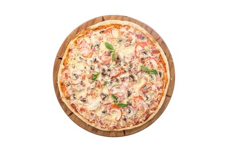 whole pizza with mushrooms, ham and cheese on wooden board isolated on white background top viewの写真素材