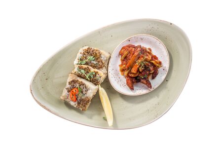 fried fish fillet in mustard with fried zucchini and eggplant isolated on white background top viewの写真素材