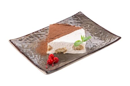 slice of Tiramisu cake traditional italian dessert on grey plate isolated on white background side viewの写真素材
