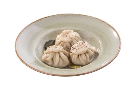 khinkali dumpling on grey plate isolated on white background side viewの写真素材