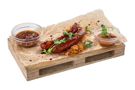 grilled sausages served with red bean and for Octoberfest isolated on white background side viewの写真素材
