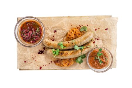 weisswurst grilled sausages served with red bean and for Octoberfest isolated on white background top viewの写真素材