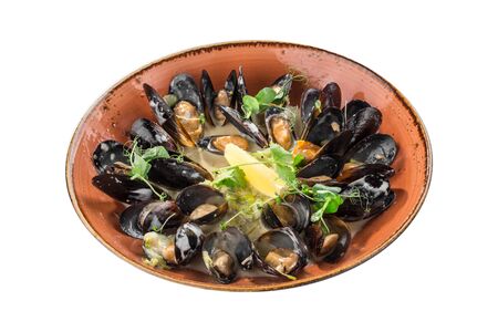 fresh mussels with cream sauce on orange plate isolated on white background side viewの写真素材