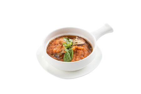 Squash zucchini or pumpkin paste puree with eggplant and basil in white bowl isolated on white background side viewの写真素材