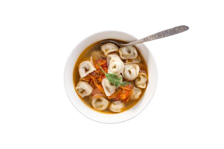 Bouillon with meat dumplings in bowl with spoon isolated on white background top viewの写真素材