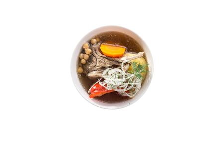 Shurpa soup with lamb meat, paprika and chikpeas in bowl isolated on white background top viewの写真素材