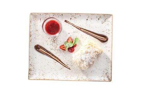 Cake Napoleon puff pastry dessert with strawberry sauce isolated on white background top viewの写真素材