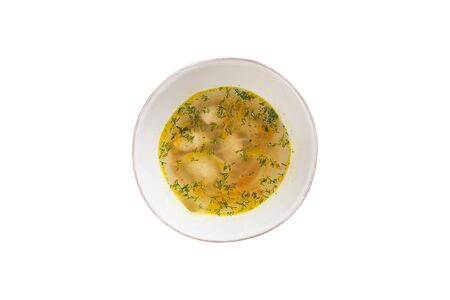 chicken broth with meatballs and herbs in bowl isolated on white background top viewの写真素材