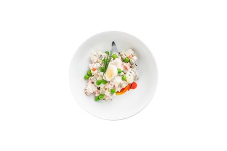 Russian traditional salad Olivier with egg and green pea isolated on white background top viewの写真素材