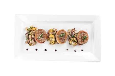 Grilled steak filet mignon wrapped bacon with potato on white plate isolated on white background top viewの写真素材