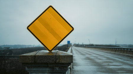 Traffic sign on the bridge in the foggy morning. Selective focus.の素材