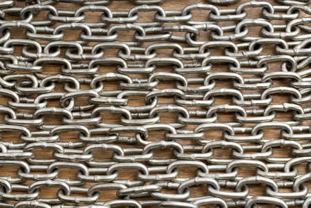 Chain on wooden surface backgroundの写真素材