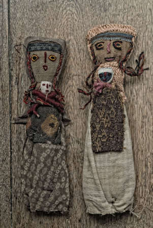 Ancient Andean Doll on wooden tableの写真素材