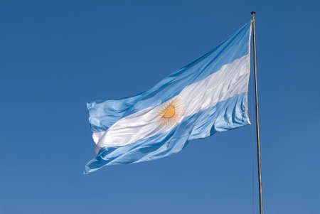 Argentina Flag on a blue skyの写真素材