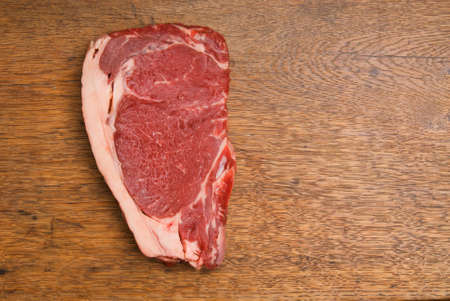 Red and Tasty Steak on a Wooden Tableの写真素材