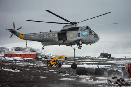 helicopter working on an Antarctic base