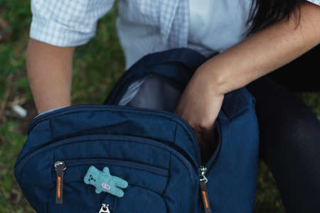 Beautiful college student in a time of rest and reading in the park.