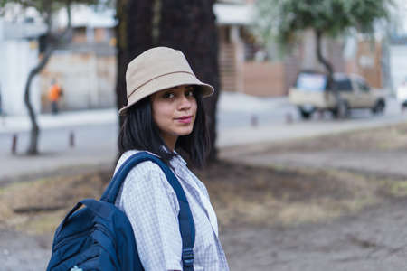 Beautiful college student in a time of rest and reading in the park.の写真素材