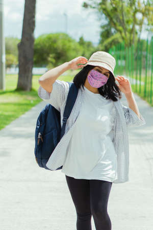 Beautiful college student in a time of rest and reading in the park.の写真素材