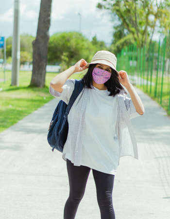 Beautiful college student in a time of rest and reading in the park.の写真素材