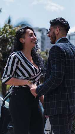 Couple of empresses walking in the city with elegant suits and happyの写真素材