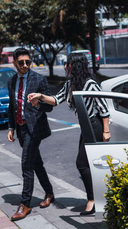 Couple of empresses walking in the city with elegant suits and happyの写真素材